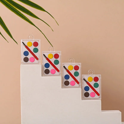 Compact six-color watercolor palette with brush